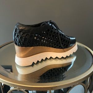 Platform lace up shoe.